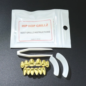 Hip hop gold teeth grillz set including upper and lower caps with molding bars and tweezers