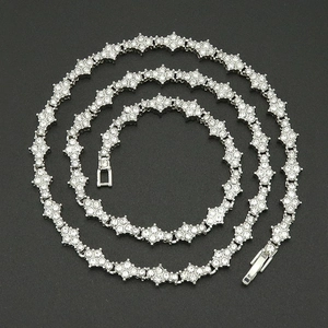 Detail of a 6mm silver-tone tennis chain with flower links and sparkling cubic zirconia stones