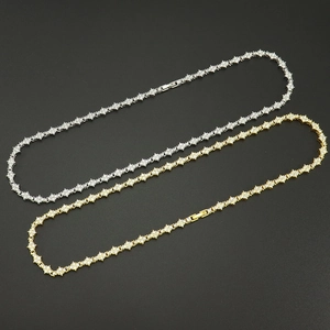 Detailed macro view of gold and silver plated tennis chains with star shaped stone links