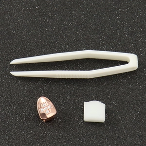 Hip-hop single tooth grillz in rose gold with cross pattern and micro-inlaid zircons