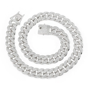 Macro detail of iced out silver Cuban link necklace with 15mm wide diamond paving