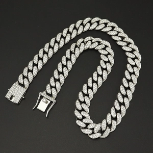Macro detail of silver Miami Cuban link chain necklace with full crystal pave setting