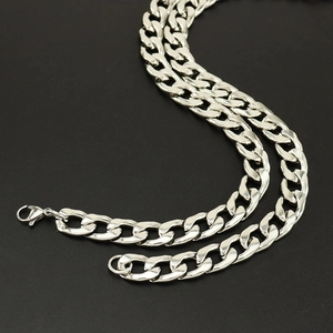 Close-up of polished stainless steel curb chain with secure lobster clasp for men