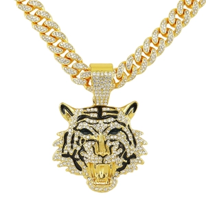 Collana hip hop con ciondolo a testa di tigre dorata, cristalli e catena cubana spessa