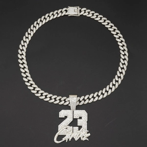 Iced out number 23 pendant necklace with silver Cuban link chain in hip hop style