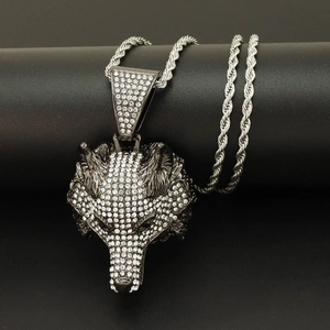 Macro detail of gunmetal wolf head pendant with micro-paved rhinestones on rope chain