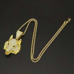 Detail of hip-hop wolf head pendant with micro-paved crystals and thick gold rope chain