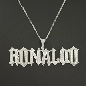Detail of Ronaldo name pendant with pavé set white zircons on a silver rope chain