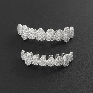 Close-up of silver-plated hip hop grillz with sparkling micro-pave cubic zirconia stones