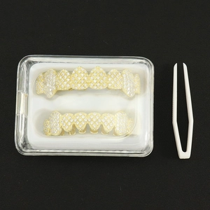 Iced out gold hip hop teeth grillz set with zircon stones, case and tweezers included