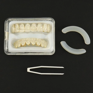 Set grillz per denti hip hop dorati con zirconi brillanti inclusi pinzetta e custodia