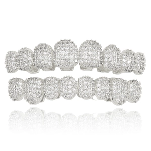 Silver-tone hip hop grillz set with sparkling iced out zircon stones on white background
