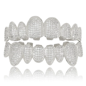 Silver iced out hip hop grillz set with zircon stones on a white background