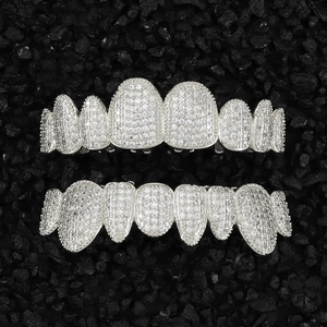 Macro detail of hip hop grillz set with shiny silver plating and cubic zirconia stones