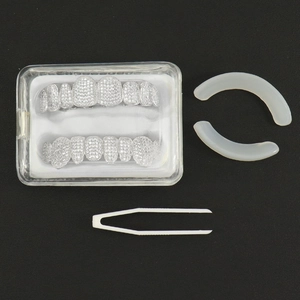 Silver hip hop grillz set with cubic zirconia teeth, silicone bars, tweezers and storage box