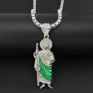 Close-up of St. Jude religious pendant with green enamel and crystal tennis chain