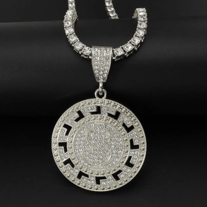 Close-up of hip hop silver pendant with dollar sign and iced-out tennis chain details
