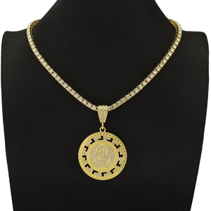 Detail of hip hop gold dollar sign pendant with sparkling diamonds and Greek key pattern