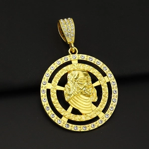 Macro detail of iced-out gold dollar portrait pendant with CZ crystals and Greek fret pattern