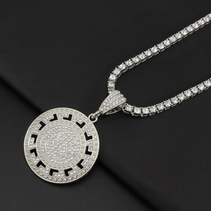 Macro shot of hip-hop tennis chain with dollar sign pendant and Greek key pattern