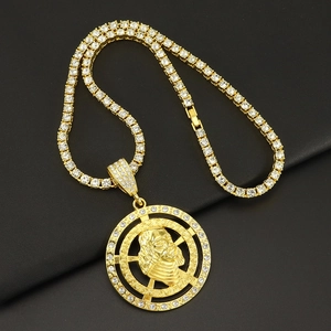 Hip hop gold tennis chain with a large iced out round portrait pendant in gold finish