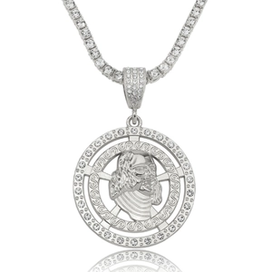 Macro detail of iced-out round pendant with Jesus portrait and sparkling tennis chain