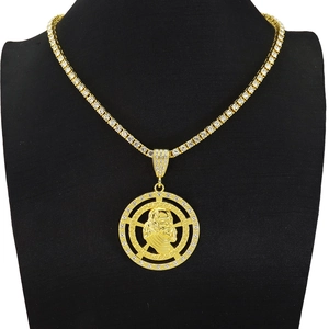 Detailed macro view of iced out round pendant with portrait relief on tennis chain