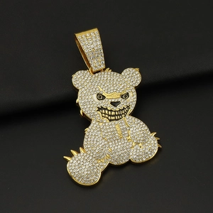 Macro shot of gold-plated hip hop bear pendant with full cubic zirconia paving
