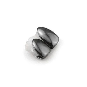 Macro shot of double fangs hip hop grillz in gun black finish with silicone mold inserts