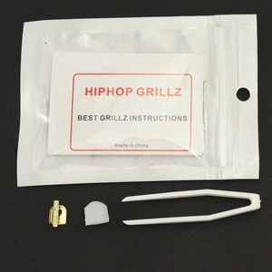Grillz dentaire simple en or avec zircones, barre de silicone et pince à épiler