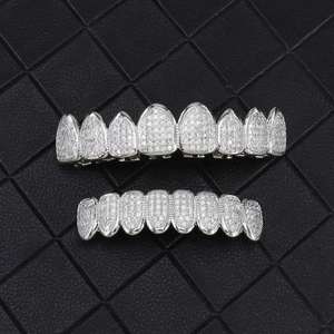 Detailed close-up of 8-tooth hip hop silver grillz with micro-pave cubic zirconia stones