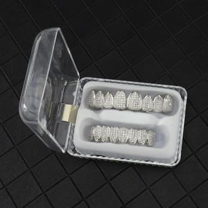 Macro shot of silver-plated hiphop grillz set with cubic zirconia in a display case