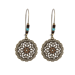 Bohemian style hollow metal floral earrings with turquoise beads in vintage bronze finish