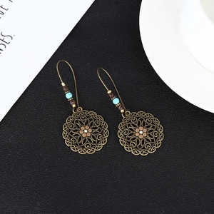 Bohemian hollow floral drop earrings with turquoise beads in antique bronze finish