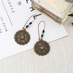 Bohemian hollow floral round dangle earrings with turquoise beads and bronze finish