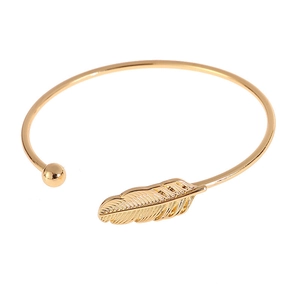 Minimalist open leaf bracelet in gold plating with feather and bead detail