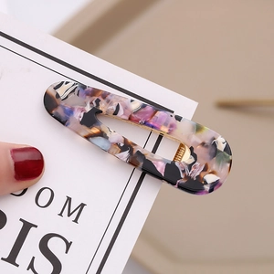 Elegant tortoiseshell acetate duckbill hair clip with colorful marble pattern and gold metal base