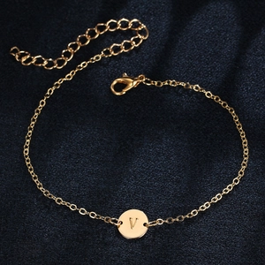 Elegant gold chain bracelet with polished circular V-letter pendant and lobster clasp