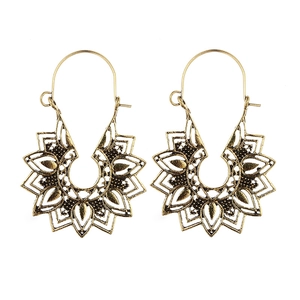 Detailed close-up of Bohemian hollow geometric gold earrings with floral textures
