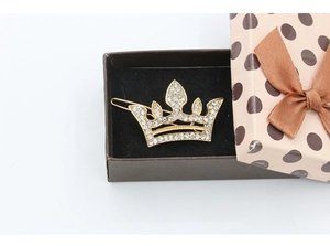 Sparkling crystal crown hair clip in a pink ribbon gift box with black velvet lining