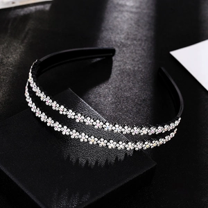 Close-up of double-layer black hairband with rhinestone plum flower pattern and non-slip comb