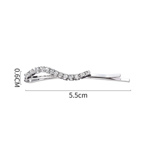 Silver wavy rhinestone hair clip set measuring 5.5cm long and 0.6cm wide on white background