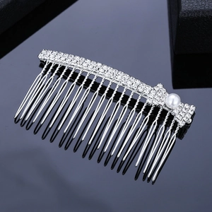 Elegant silver bridal hair comb with shimmering rhinestones and a white pearl detail