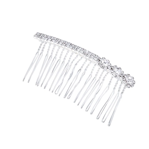 Macro detail of silver alloy hair comb with sparkling rhinestones and floral crystals