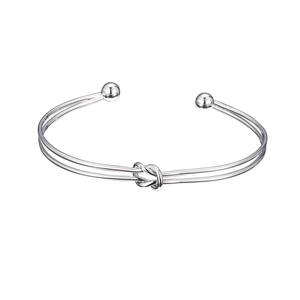 Minimalist silver double-layered open bangle featuring a centered love knot and ball ends