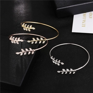 Three-piece leaf open cuff bracelet set with sparkling crystals in gold, rose gold and silver