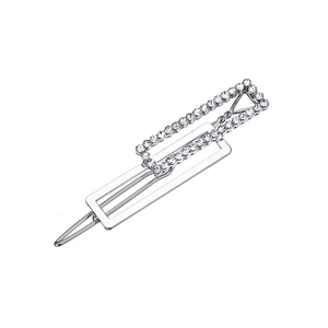 Detail view of silver square metal hair clip featuring nested geometric rhinestone design