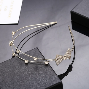 Double-layered gold rhinestone headband with elegant sparkling bow for women
