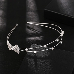 Elegant double-layered silver headband with rhinestones and a sparkling crystal bow