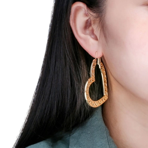 Bohemian gold heart-shaped dangle earrings with intricate hollow-out vintage carvings